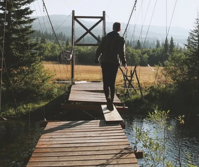 A broken bridge with a side path