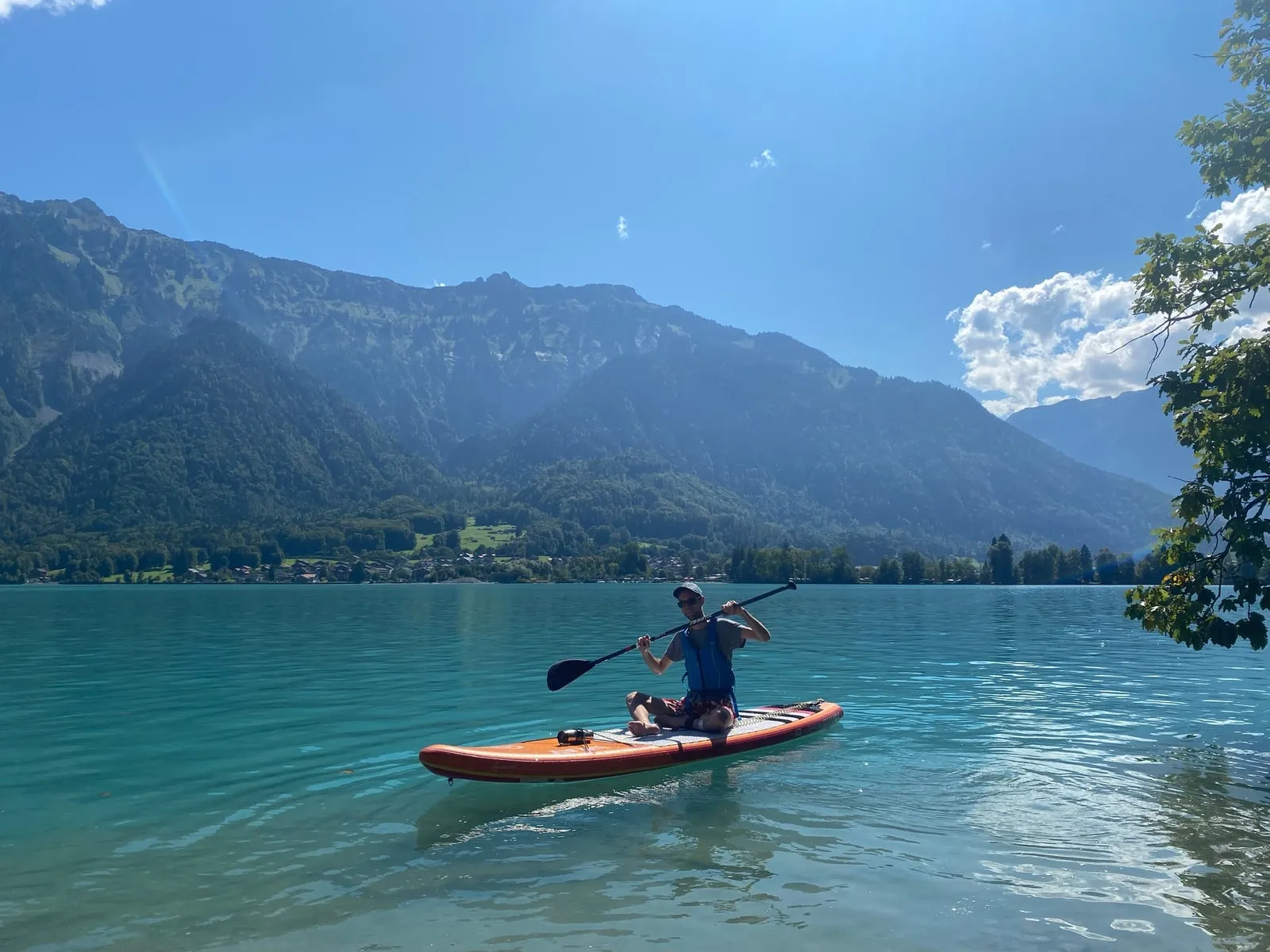 David Nowak paddleboarding on a mountain lake