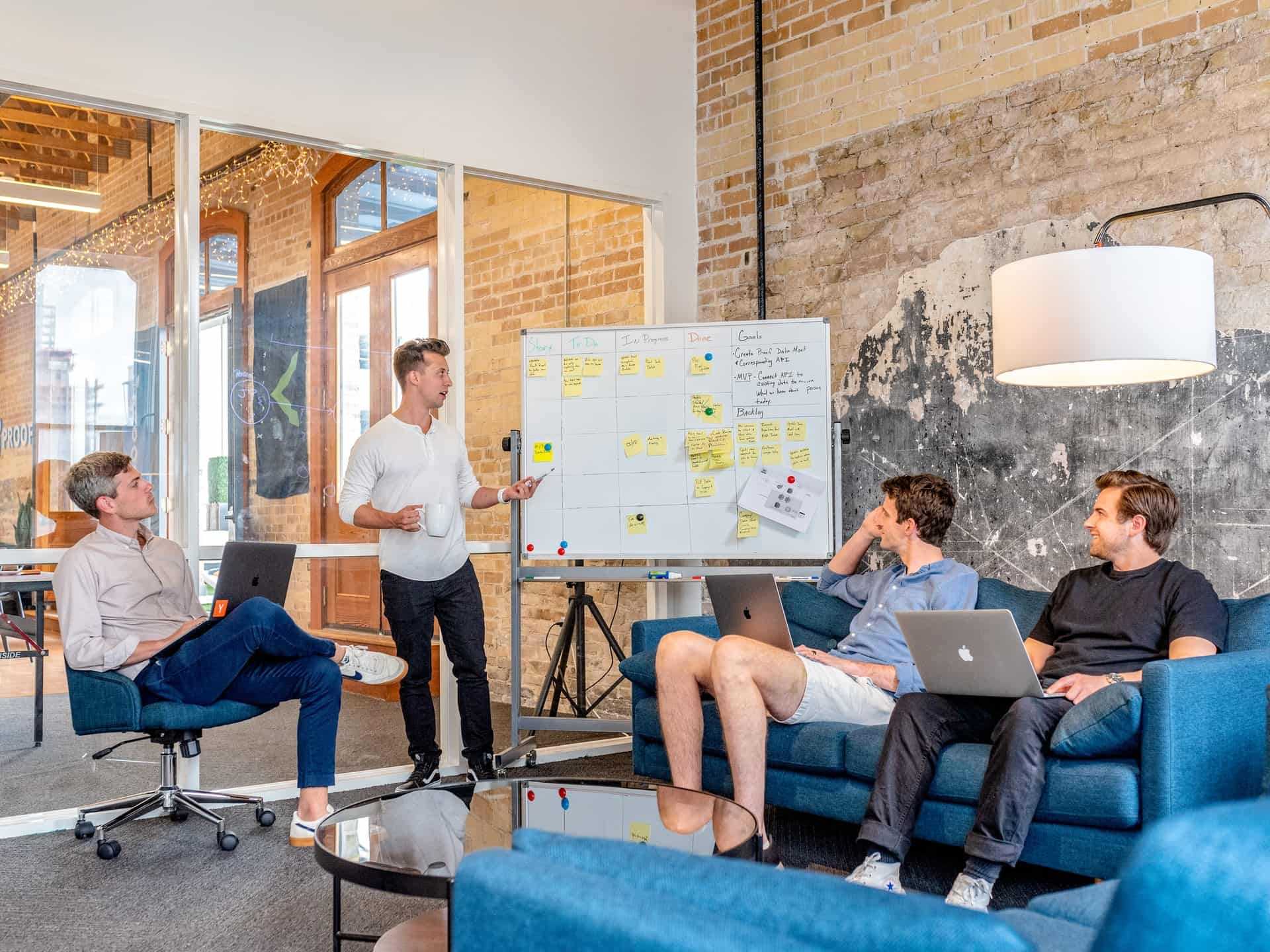 A team discussing their startup idea in a room.