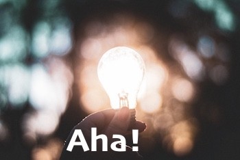 A lightbulb moment with "Aha!" text